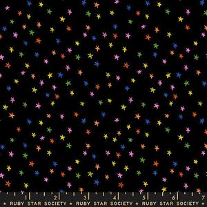 May include: Black fabric with a scattered pattern of colorful stars in shades of pink, yellow, green, orange, and blue. The text "RUBY STAR SOCIETY" is at the bottom.