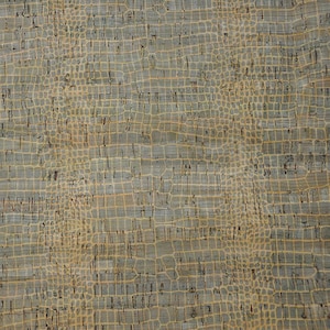 May include: Close-up of a textured surface with a pattern resembling crocodile skin. The color palette includes shades of gray, tan, and brown, creating a natural and organic aesthetic. This material could be used for various craft projects.