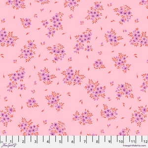 May include: Pink fabric with a repeating pattern of small purple and red flowers. The fabric is shown with a ruler for scale.