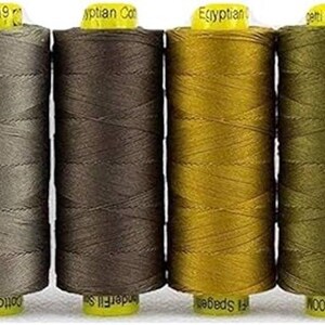 May include: Ten spools of thread in various colors, including white, beige, brown, yellow, green, and orange. Each spool is labeled with the brand name "WonderFil" and the length of the thread in meters.