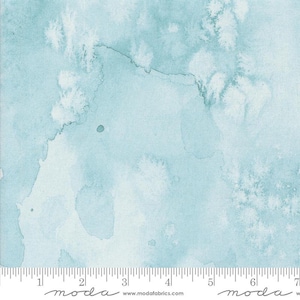 May include: A light blue watercolour fabric with a subtle white and light blue pattern. The fabric has a soft, textured feel and is perfect for quilting, sewing, and crafting.