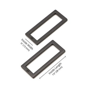 Puede incluir: Dos anillos rectangulares de metal negro con un ancho interior de 1 1/2 pulgadas (13 mm) y una longitud interior de 1 1/2 pulgadas (38 mm).