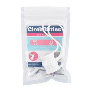 May include: A clear plastic bag containing a white magnetic clasp with a white cord and a product label. The label features the text "Cloth Birties" in a blue and pink design, along with a pink and blue graphic.