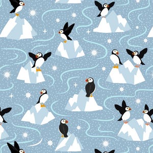 May include: A repeating pattern on a light blue background featuring black and white puffins with orange beaks and feet standing on white icebergs. The design includes white starbursts, swirling light blue lines, and small white dots.