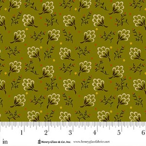 May include: Olive green fabric featuring a repeating pattern of cream-coloured fan-shaped floral motifs, dark brown stems, and small yellow stars. A white ruler at the bottom shows a scale of 6 inches, with the text Henry Glass & Co. Inc.