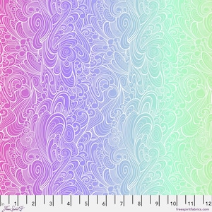 May include: A fabric with a colour gradient from pink to purple, then to blue and finally to green. The fabric features a white, swirling, and flowing pattern. The image includes a ruler with inch measurements.