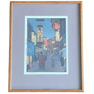 Signed Japanese Woodblock Print by Toshi Yoshida “Sinjuhn” Evening Street Scene Framed
