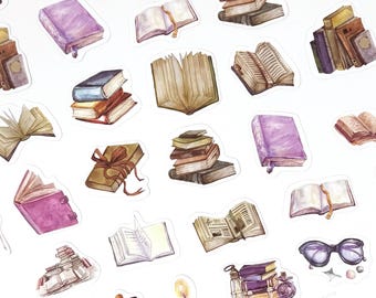 May include: A collection of watercolor stickers featuring various books in different sizes and colors. Some books are open, revealing their pages, while others are closed. The color palette includes shades of brown, purple, and gold.