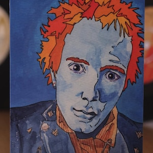 Johnny Rotten wenskaart ontleend aan mijn originele schilderij. 6x4 kwaliteit digitale printkaart oranje en blauw Brits punkicoon Sex Pistols