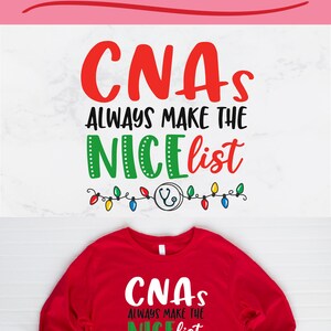 May include: Red and green Christmas-themed design with the text "CNAs Always Make The Nice List" and a stethoscope with Christmas lights. The design is on a red long-sleeve shirt.