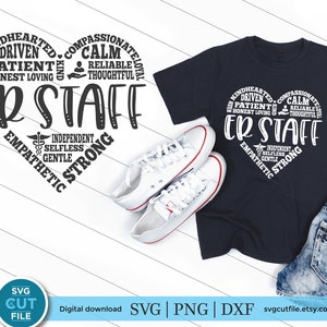 May include: A navy blue t-shirt and a white pair of sneakers are displayed on a white wooden surface. The t-shirt features a heart-shaped design with the words "ER STAFF" and related positive attributes. The image also includes a pair of denim shorts.