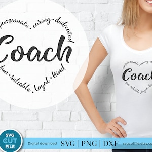 May include: A white t-shirt with a black circle design that says "Coach" in a large, stylized font. The circle is surrounded by the words "compassionate, caring, dedicated, fun, reliable, loyal, kind".
