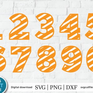 May include: Orange and white striped numbers 1 through 0. The numbers are outlined in white and have a bold, rounded font. The numbers are on a white brick background.