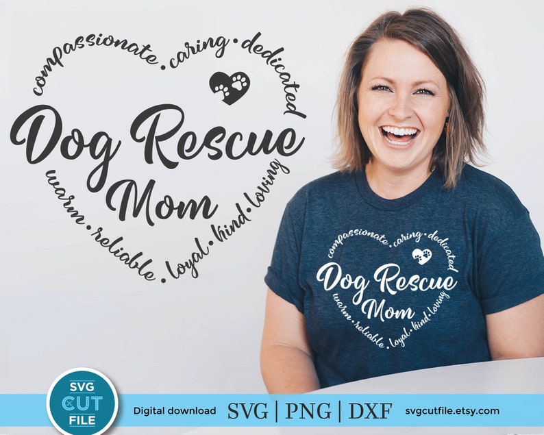 May include: A blue t-shirt with a white heart design that says "Dog Rescue Mom" with the words "compassionate, caring, dedicated, warm, reliable, loyal, kind, loving" around the heart.