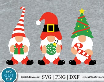 May include: Three Christmas gnomes with different hats and accessories. The gnome on the left is wearing a red and white striped hat and holding a wrapped gift. The gnome in the middle is wearing a red Santa hat with a black belt and holding a green Christmas ornament. The gnome on the right is wearing a green Christmas tree hat and holding a candy cane.