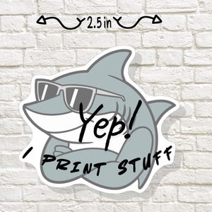 May include: A white ceramic mug with a black handle and the text "But First, Coffee" in a bold, black font. The mug is set against a neutral background, highlighting its simple design.