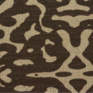 May include: A brown fabric with a beige abstract pattern. The pattern resembles a camouflage design.