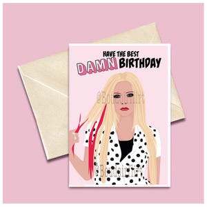 May include: A pink birthday card with a cartoon illustration of a woman with blonde hair and a black and white polka dot shirt. The text on the card reads "Have the best DAMN BIRTHDAY".