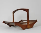 Staved teak magazine rack designed by Jens Quistgaard for Dansk. Denmark, 1960s.