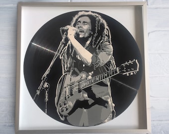 Reggae-Malerei auf Vinyl-Schallplatte - gerahmt und bereit zum Aufhängen. Vinyl-Schallplattenkunst