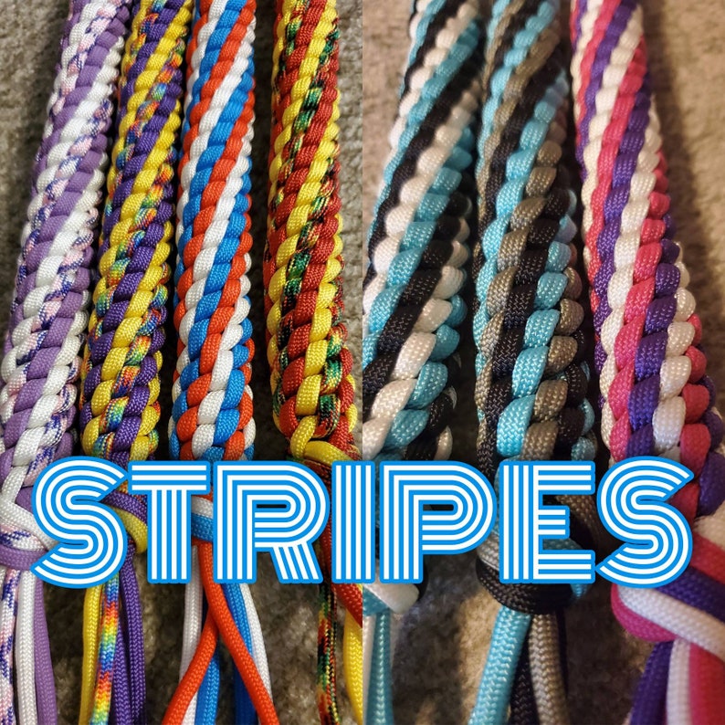 May include: Close-up of several braided cords in various colours, including purple, yellow, red, blue, and black. The word "STRIPES" is displayed in a blue and white striped font across the bottom of the image.