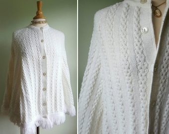 Vintage 1960s 1970s ivory white cream crochet poncho cardigan jacket sweater, fringe hem, button front, dress or casual, cable knit