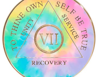 May include: A circular, tie-dye patterned, gold-rimmed medallion with a triangle in the center. The triangle has the words "To Thine Own Self Be True" written around it, with the words "Unity", "Service", and "Recovery" at the bottom. The number "VII" is in the center of the triangle.