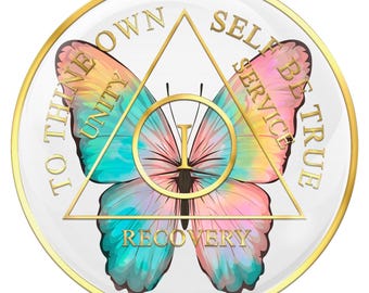 May include: A white circular coin with a gold rim features a colorful butterfly with a pink, blue, and yellow design. The butterfly is centered within a triangle with the words "To thine own self be true" written around the triangle. The words "Unity, Service, Recovery" are written within the triangle.