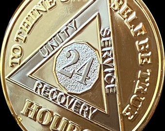 May include: Gold-toned coin with a triangle design featuring the words "To Thine Own Self Be True" and "24 Hours" with the words "Unity", "Service", and "Recovery" inscribed within the triangle. The center of the coin features the number "24" in a silver-toned circle.