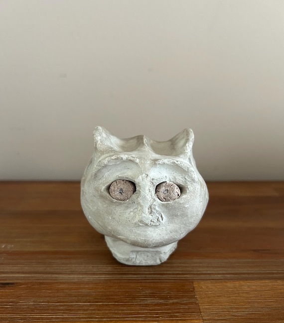 A one-of-a-kind vintage folk-art clay monster/gremlin head, artist-initialed — the kind of weird signed studio pottery you find once and never again.