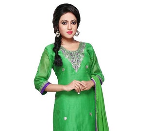 May include: A green salwar kameez with silver and purple embroidery. The outfit includes a long-sleeved top, trousers, and a matching dupatta.
