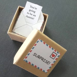 We're having a baby.
A tiny card in a box