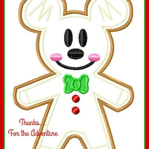 May include: A white gingerbread man with a green bow tie and red buttons. The gingerbread man has a Mickey Mouse face and the text "Thanks... For the Adventure" is below the gingerbread man.