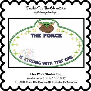 May include: A Star Wars stroller tag with a green oval design, featuring the text "THE FORCE" and "IS STRONG WITH THIS ONE." The tag includes a character image and star accents. Available in various sizes.