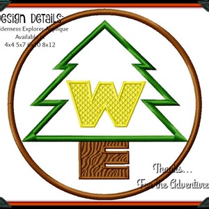May include: A green pine tree with a yellow "W" inside and a brown base with the letter "E" on it. The tree is inside a brown circle with the text "Thanks... For the Adventure" below it. The text "Design DETAILS Wilderness Explorer Applique Available 4x4 5x7 6x10 8x12" is above the circle.