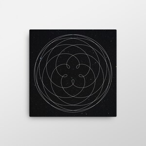 May include: Square canvas art featuring a white, intricate, swirling line design against a black background speckled with tiny white dots. The design is a series of interconnected circles and a central floral-like shape.