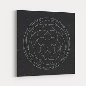 May include: Square canvas art featuring a white, geometric design against a dark, speckled background. The design is a series of interconnected, curved lines forming a circular pattern. The canvas is mounted on a white wall.