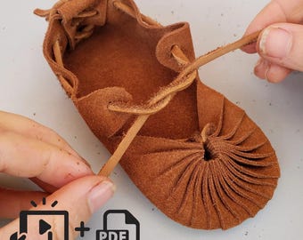 May include: Brown leather sandal with a unique pleated design and a lace-up closure. The sandal is being tied by a hand.