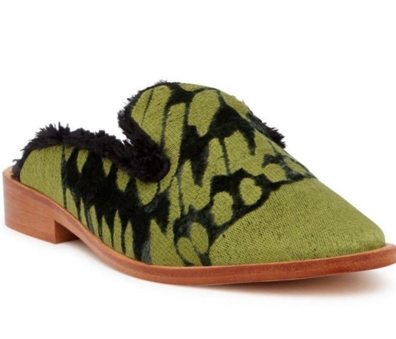 May include: Green velvet mule with a black butterfly pattern and a wooden heel.