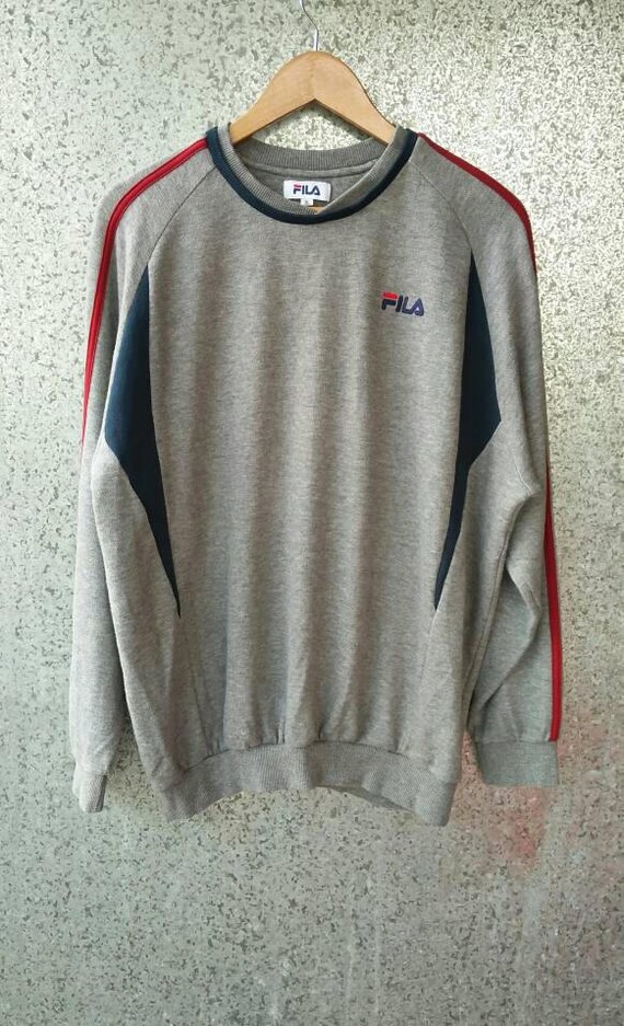 white sweatshirt with rainbow stripe