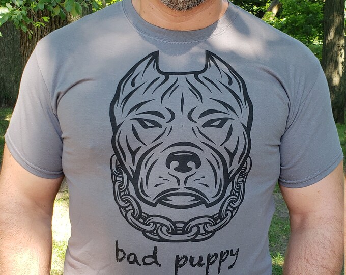 Featured listing image: GAY BAD PUPPY image on a charcoal gray Gildan brand all cotton tee shirt