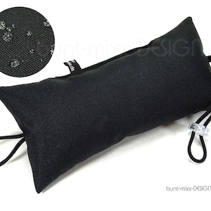 May include: Black doorstop cushion with a drawstring closure and a small tag that says "bunt-mix-DESIGN". The cushion is made of water-resistant fabric.