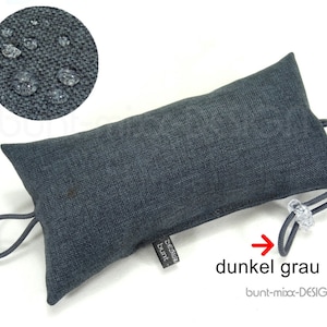 May include: A dark grey doorstop made of fabric with a drawstring closure. The doorstop is water-resistant and has a label that says "bunt-mix-DESIGN".