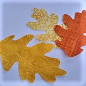 Fall colors Oak leaves fabric die cut fused 12 per pkg