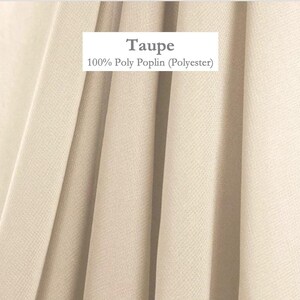 a close-up view of a fabric with a light beige color.