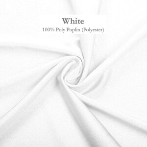 a close-up view of a white fabric, possibly a polyester material, with a slight curl and texture.