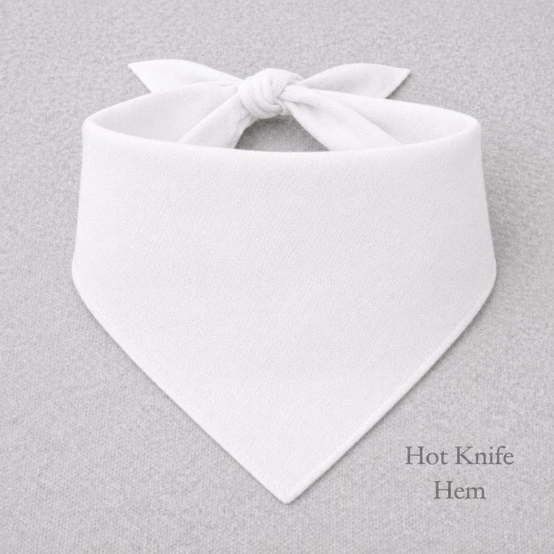 A white bandana tied in a bow, with the text "Hot Knife Hem" written below it.