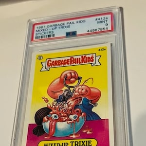 Garbage Pail Kids Topps Etiqueta adhesiva de tarjeta comercial calificada PSA 9 MINT vintage 1987 Mixed Up Trixie #412 Población 7 pop RARE mezclador