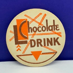 MILK BOTTLE CAP vintage dairy grade A pasteurized farm advertising vtg pog 1930s ephemera Lc chocolate drink L americana orange brown usa us
