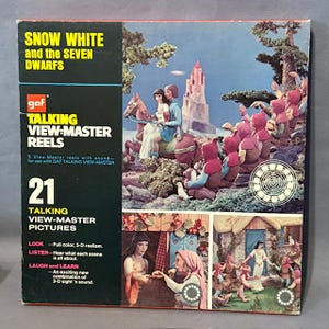 May include: A vintage GAF Talking View-Master Reels set featuring Snow White and the Seven Dwarfs. The box displays colourful 3D images of the characters and scenes. The set includes 21 talking View-Master pictures, promising full-colour 3-D realism.
